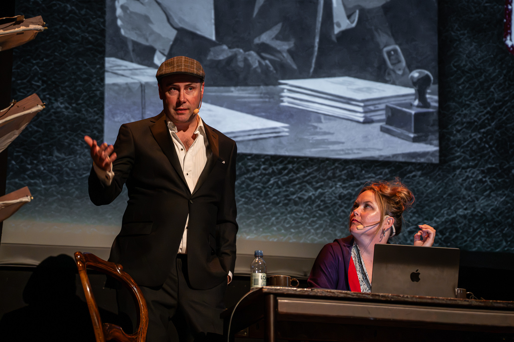 Shannon and Parker Selbert presenting a murder mystery talk at Goatmire 2026